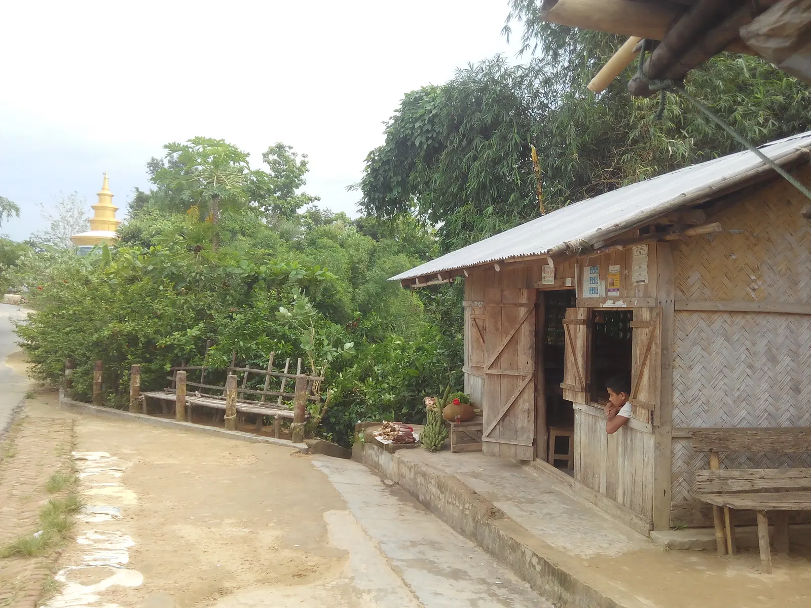 A small street shop in Rangamati, Bangladesh, its goods stacked along the front counter.